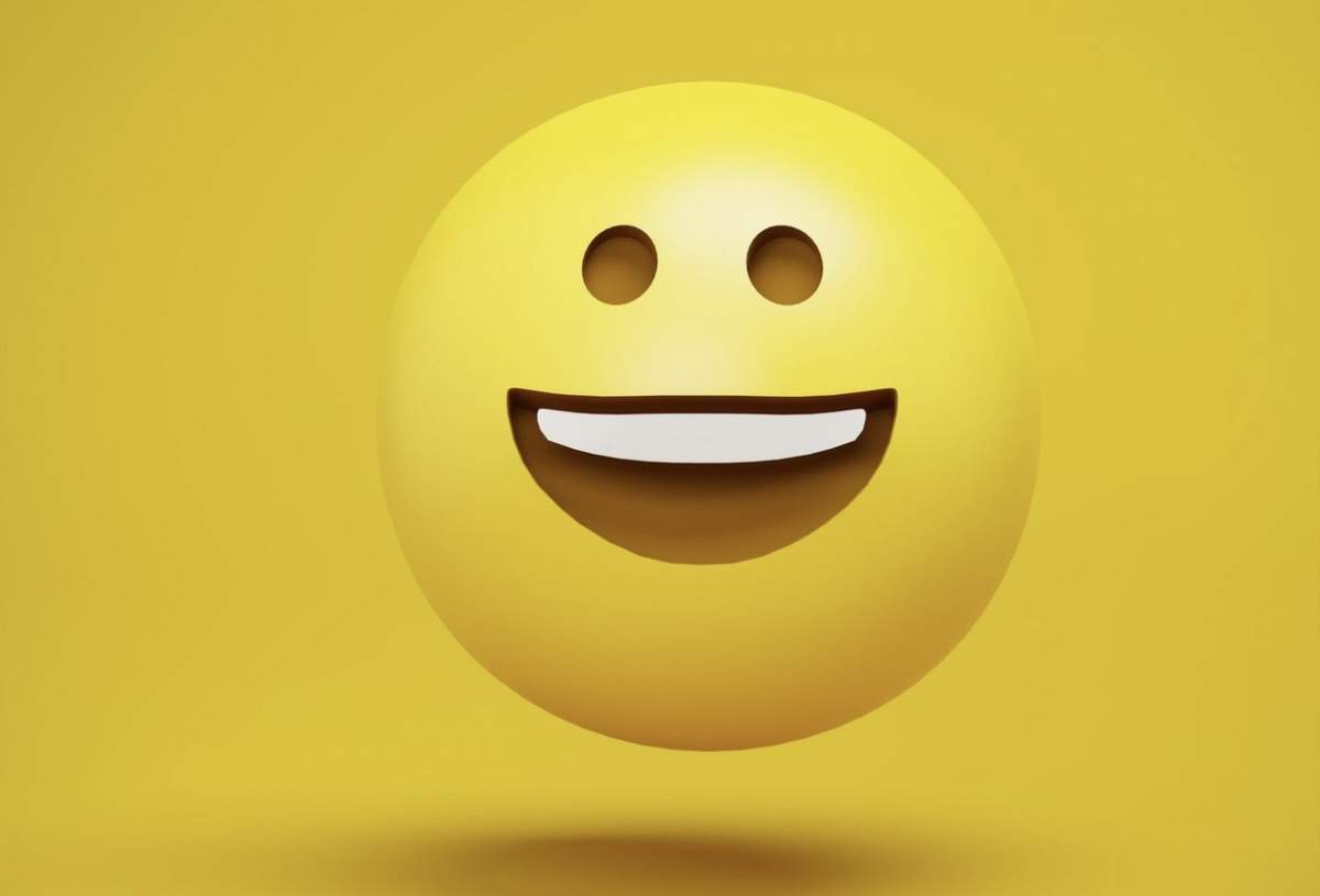 Un emoji care râde