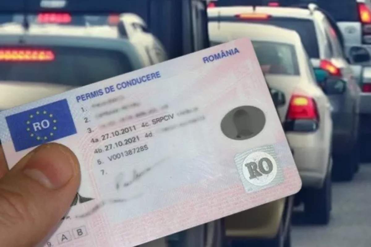 permis de conducere tinut in mana