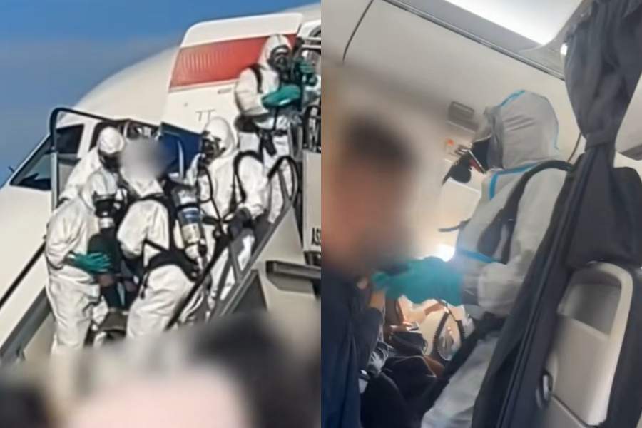 Imagini alarmante! Un avion a aterizat de urgență, iar autoritățile au folosit echipamente de protecție folosite și în pandemie pentru a evacua pasagerii
