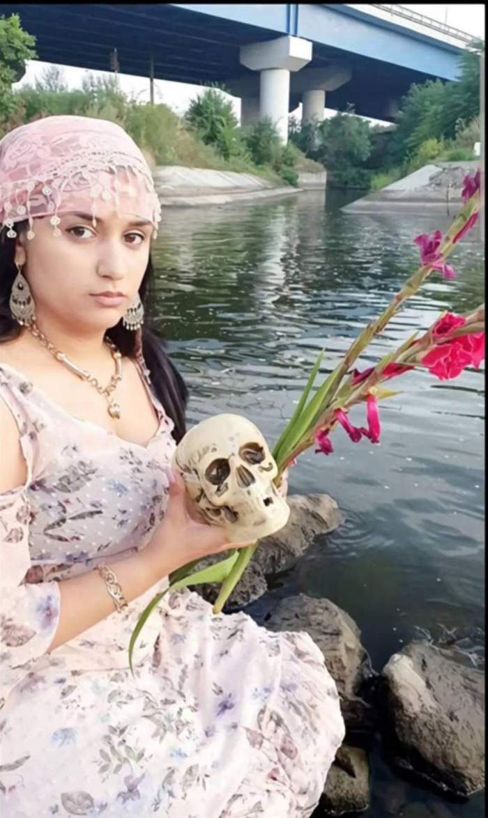 Melek, cu un craniu în mână