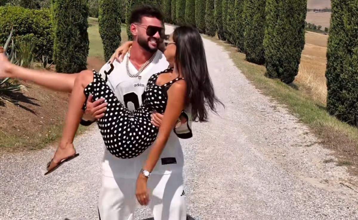 Dorian Popa, ținându-și soția în brațe