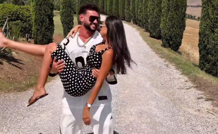 Dorian Popa, ținându-și soția în brațe