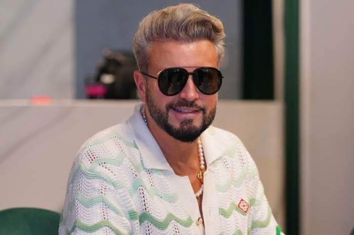 catalin botezatu cu ochelari de soare la ochi
