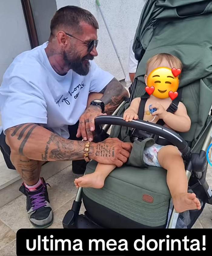 Andrei Rotaru lângă un bebeluș